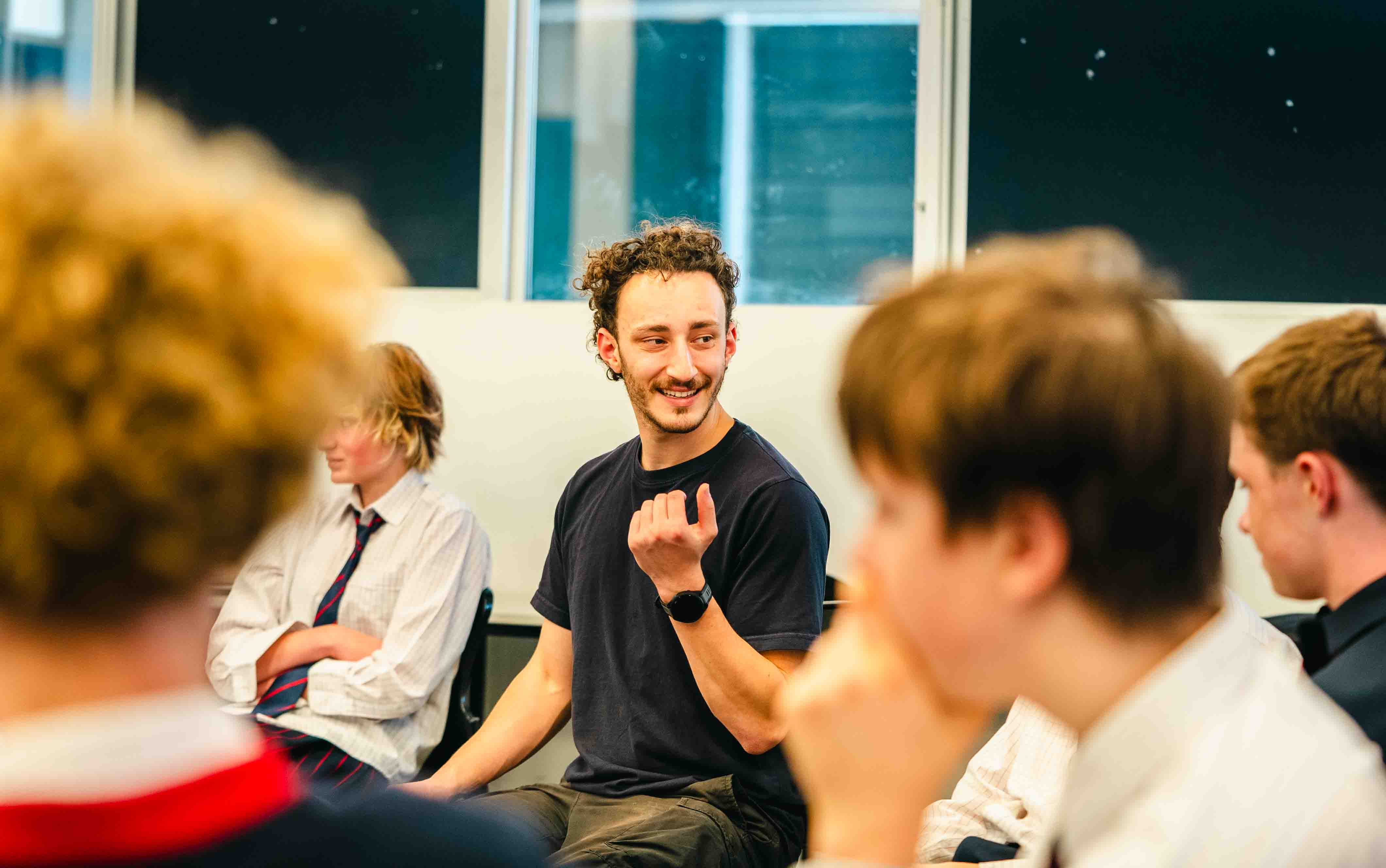 A Toolbox facilitator leading a discussion with secondary school students